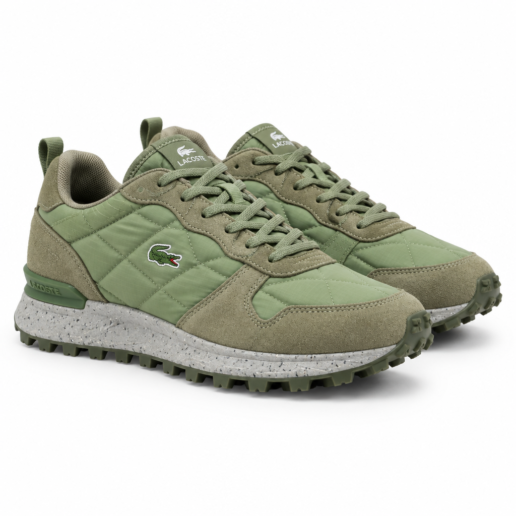 Olive green quilted sneakers with khaki suede overlays and trail sole on a plain white background