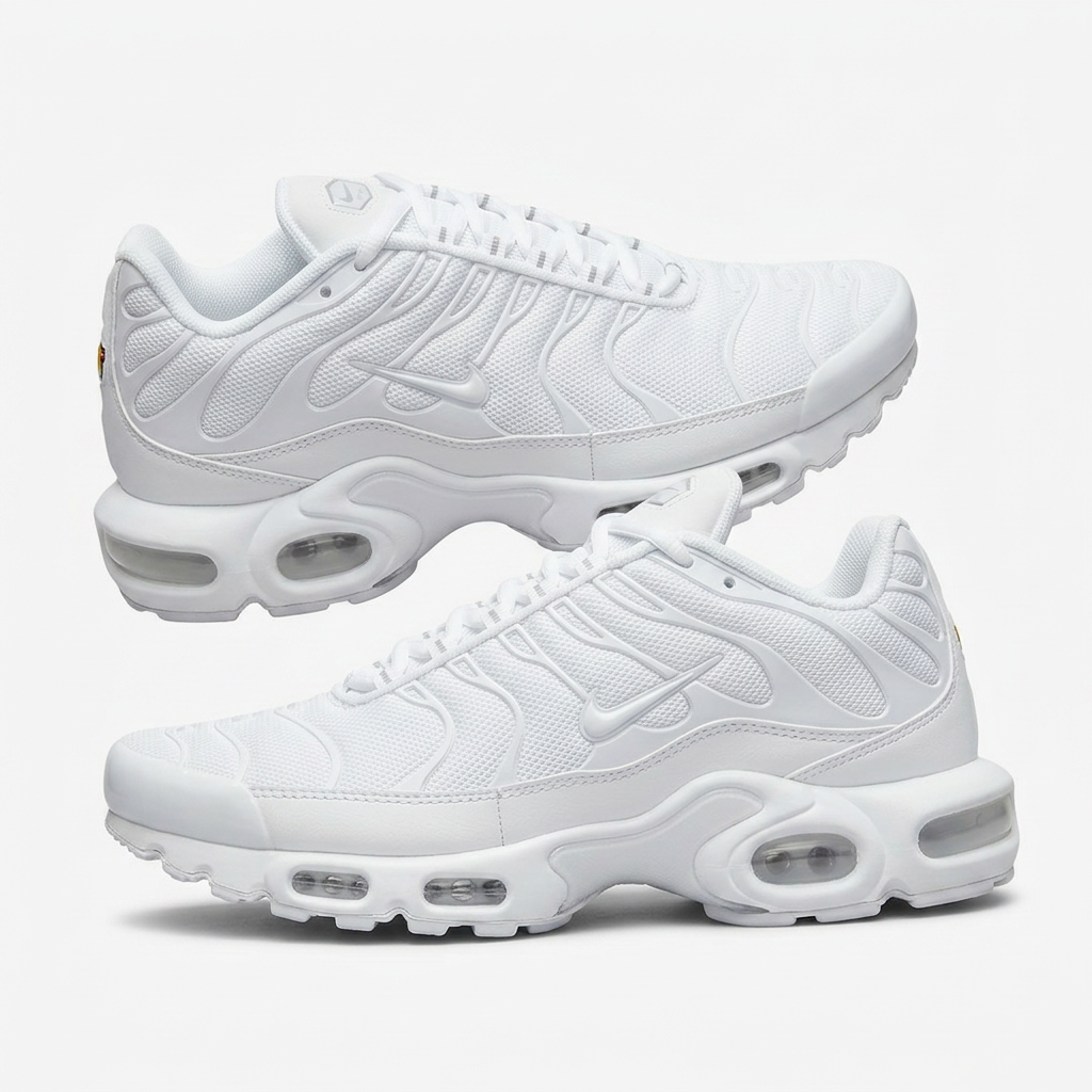 All white Air Max Plus with the classic wavy cage and visibl on a plain white background