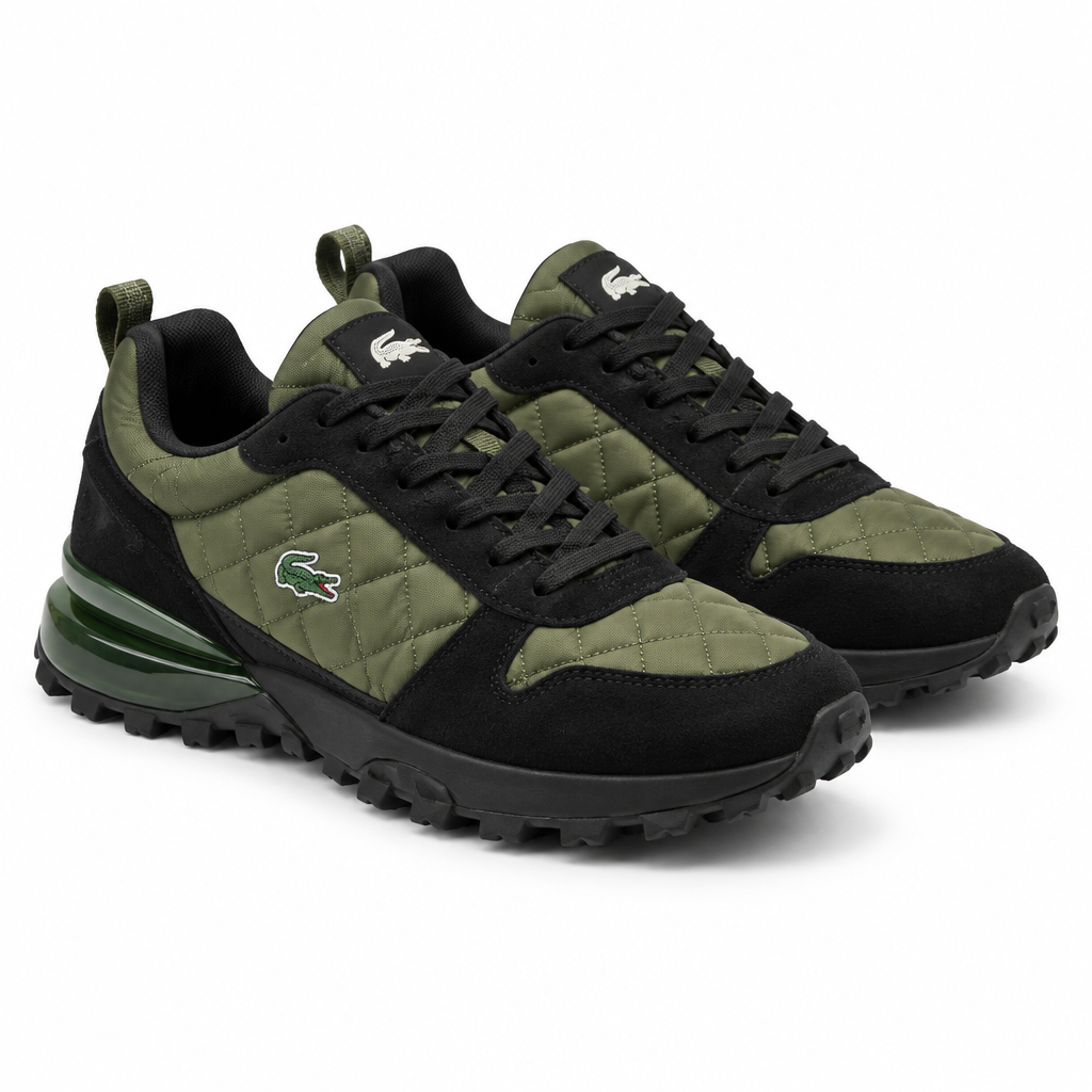 Black and olive quilted sneakers with green translucent heel accent on a plain white background