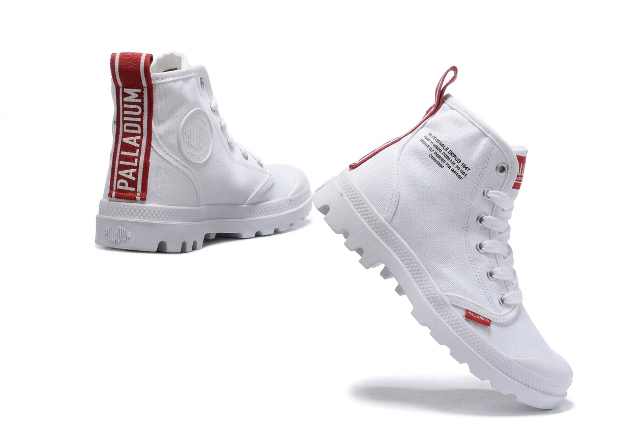 Pair of white Palladium Pampa Hi boots with red heel tape on white