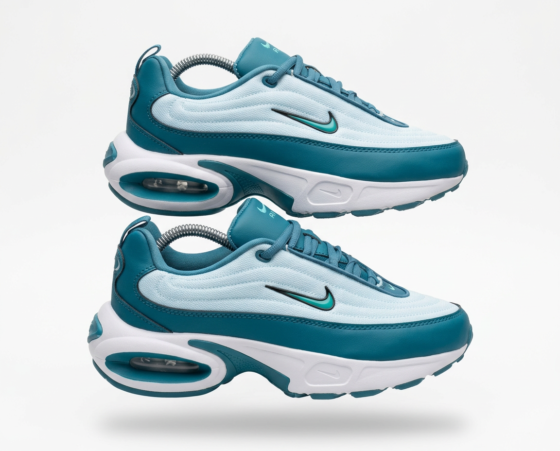 Pair of teal and ice blue Nike Air Max Portal sneakers on white