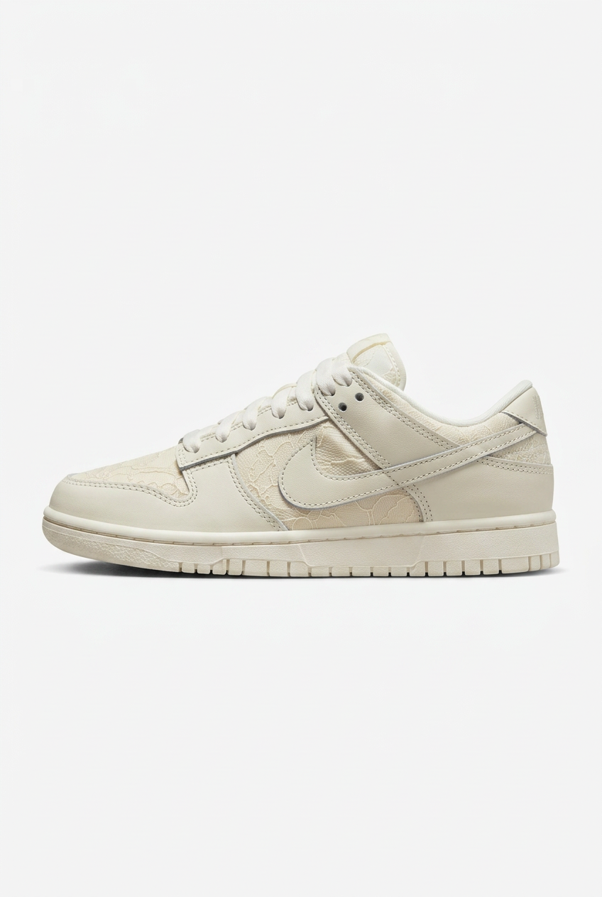 Cream low-top sneaker with tonal floral lace panels and white laces on a plain white background
