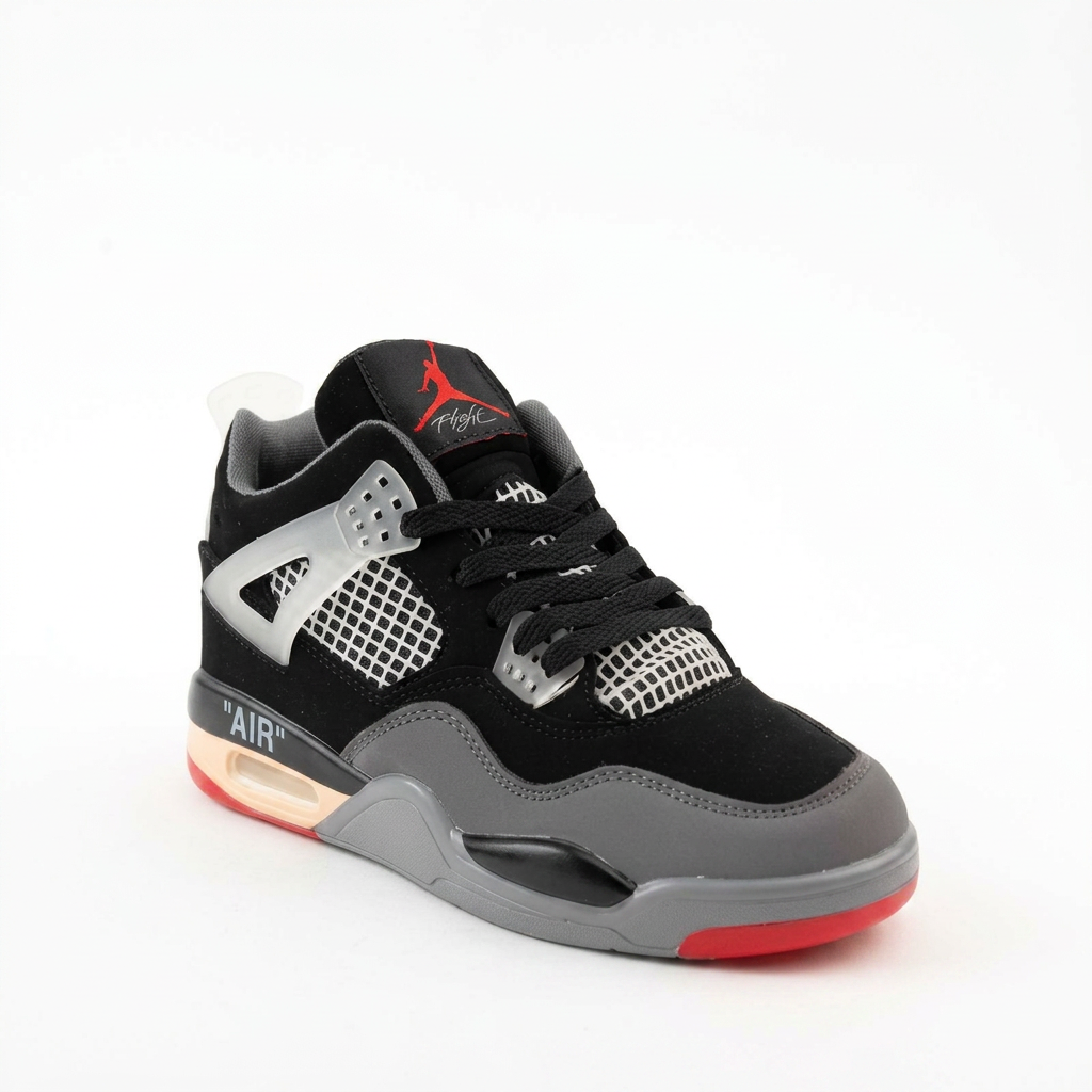Air Jordan 4 sneaker in black nubuck with cement grey midsole and red accents, side view