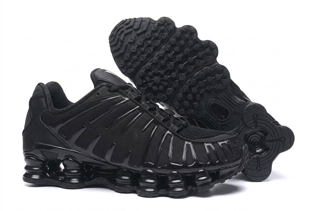 Triple black column sole running sneaker pair on a plain white background