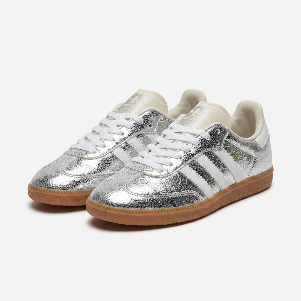 Metallic silver cracked leather adidas Samba with gum sole on a plain white background