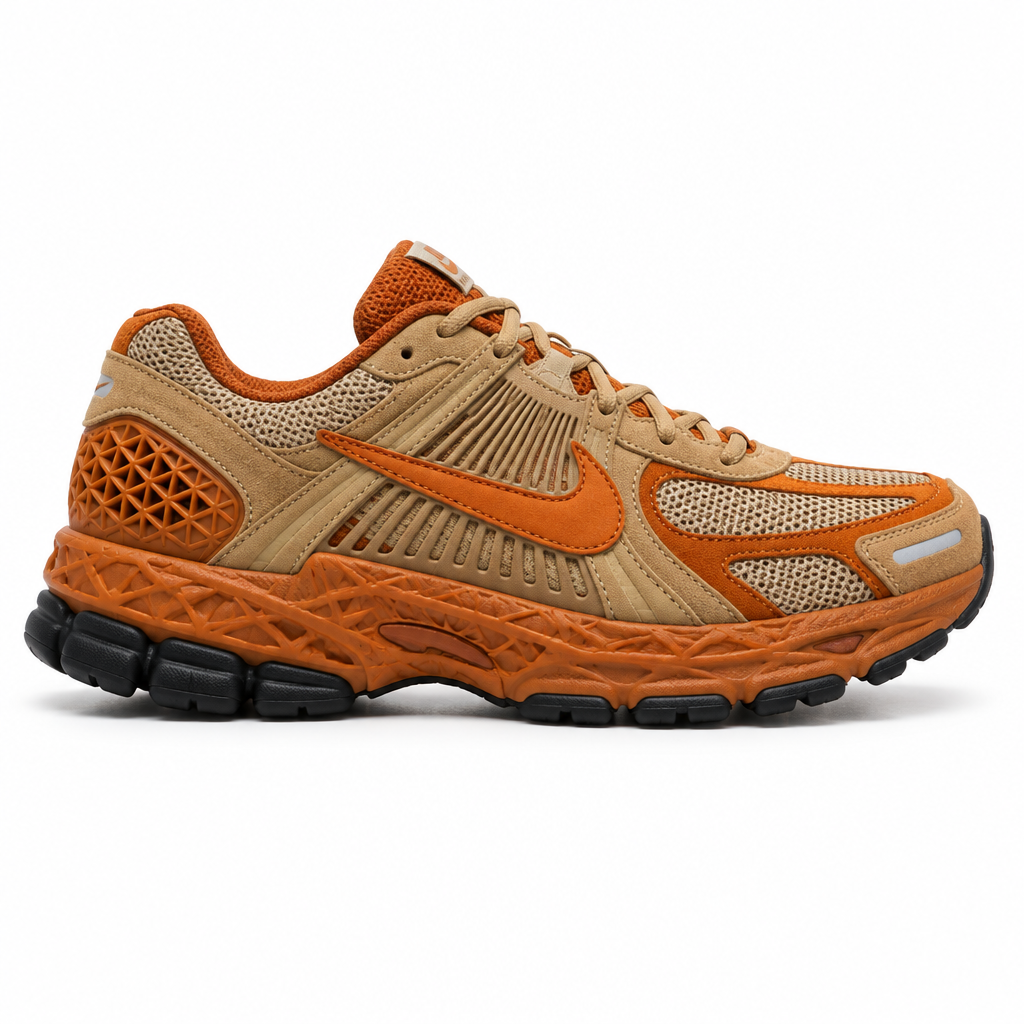 Tan and burnt orange chunky running sneaker with orange swoosh on a plain white background