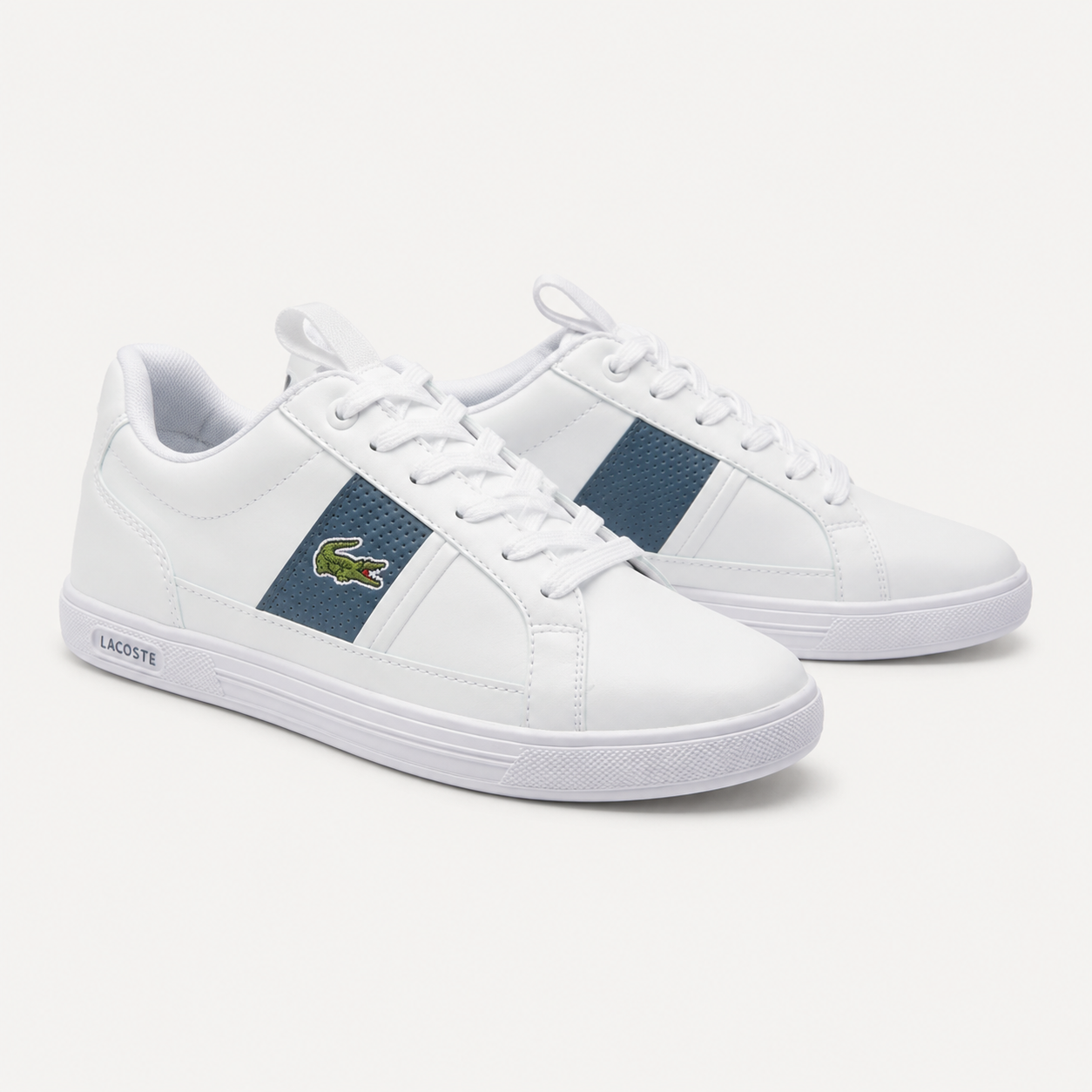 Lacoste Europa leather sneakers in white with navy perforated side panel, angled pair view