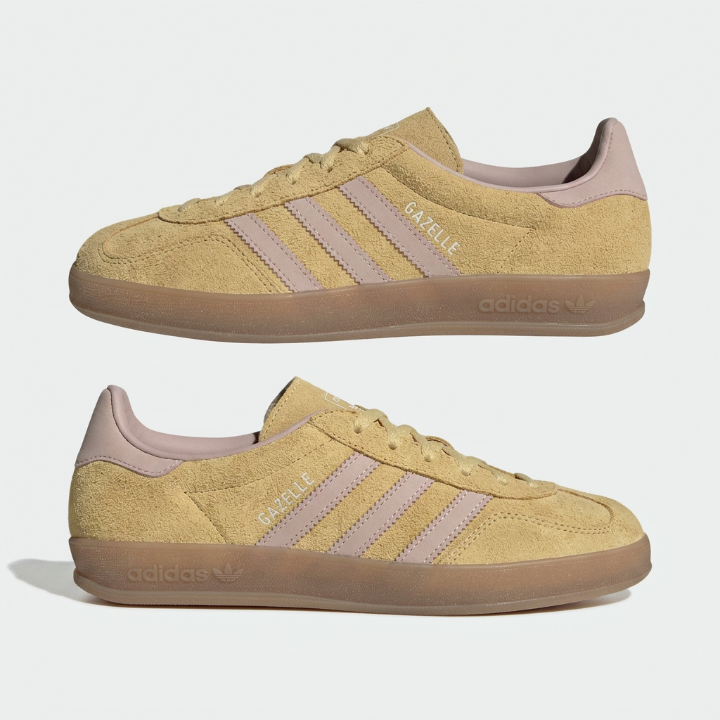 Almond yellow suede indoor low top sneakers with pink stripes and gum sole on a plain white background