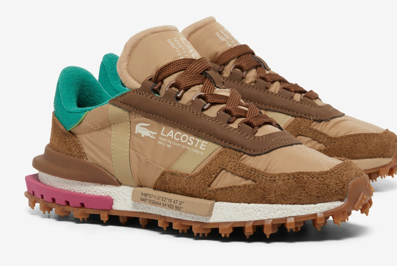 Tan and brown Lacoste Elite Active runner with teal heel on a plain white background