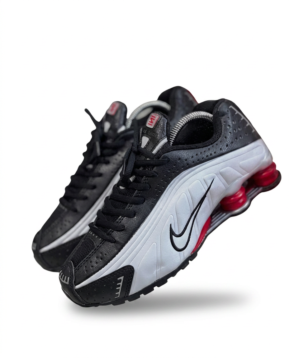 Nike Shox R4 sneakers in black leather with white midsole and red shox columns