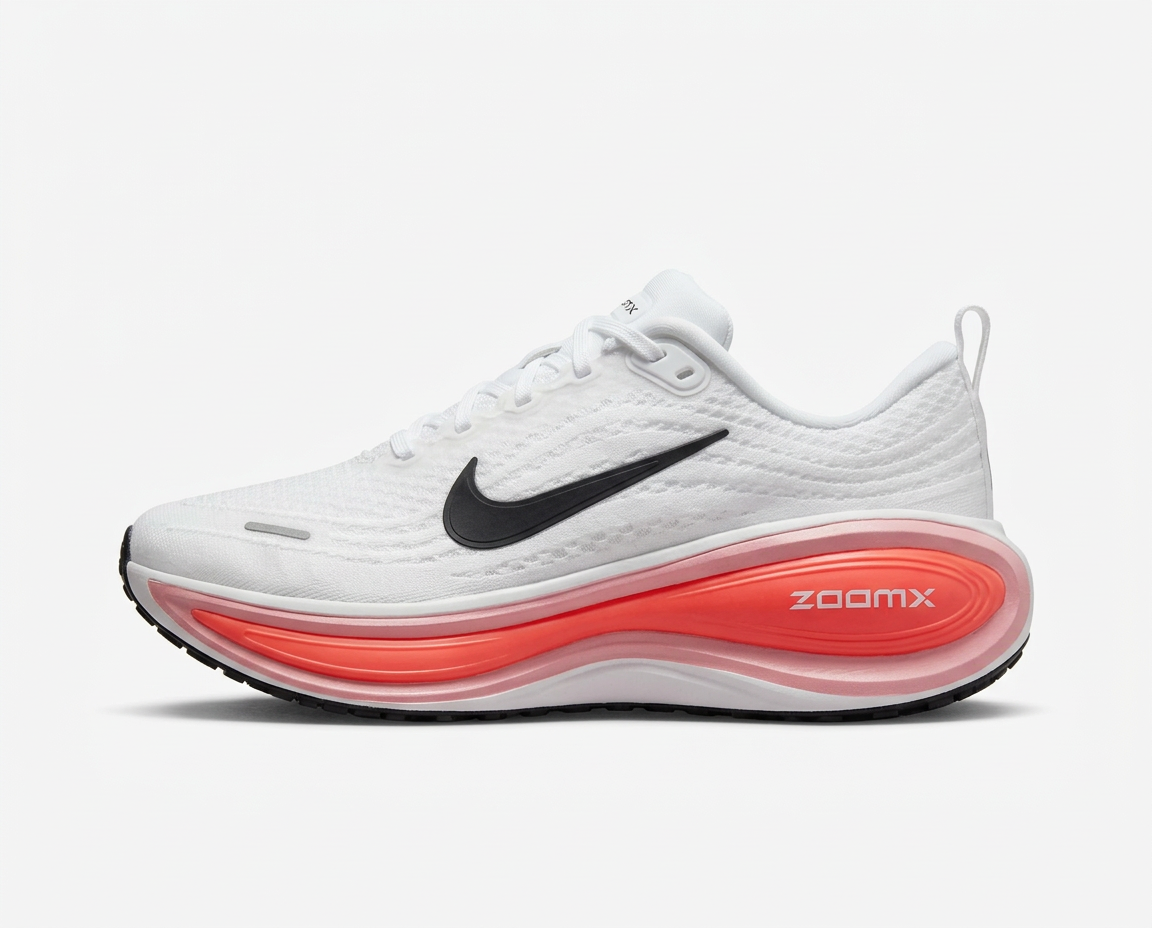 White mesh running sneaker with black swoosh and oversized coral cushioned midsole on a plain white background